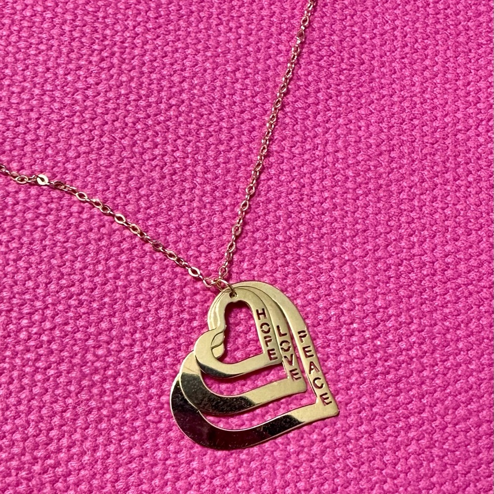 Beautiful Gold Chain Necklace with 3 hearts 14k

Hope love peace